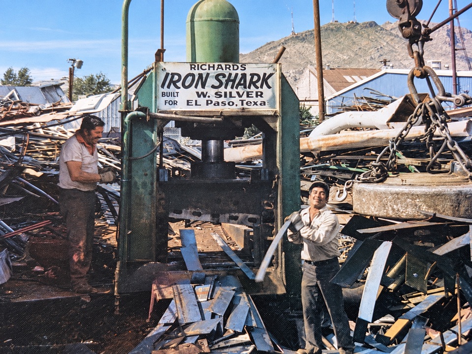 Iron Shark equipment and two workers — AI-restored archival image