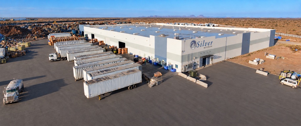 Santa Teresa warehouse and loading trailers, edited visualization with paving, WSR signage and cleared entrance parking